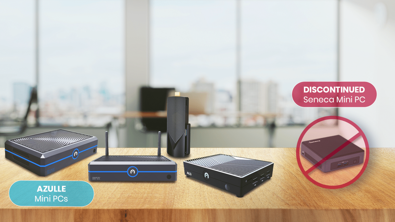 A table with a laptop, a tablet, a PC, and a Seneca mini pc.