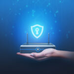 A hand presenting a mini PC with a protective shield icon, symbolizing secure wi-fi and data security.