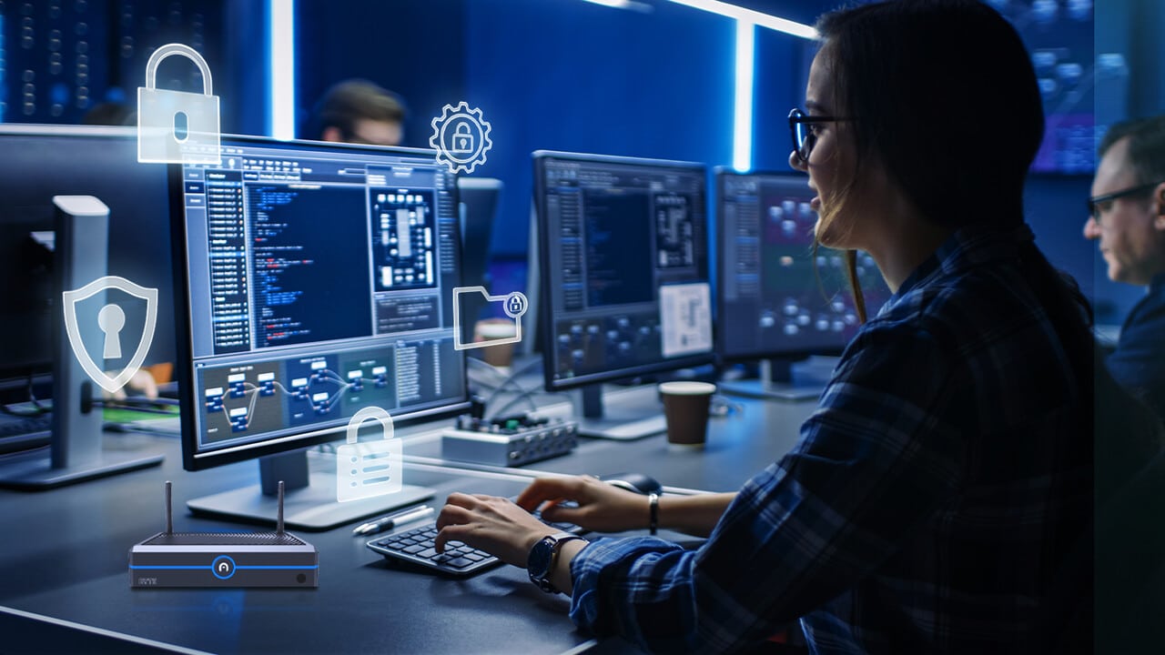 Cybersecurity professional combating malware at a computer station with encryption and data protection icons visible on the screen.