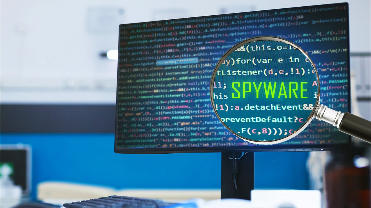 Computer screen displaying code with the word "spyware" highlighted, suggesting a malware concept.