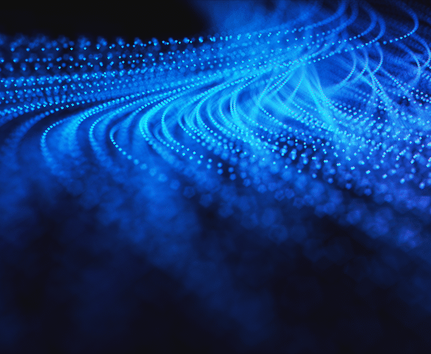 Abstract image of flowing blue light dots forming curved wave patterns on a dark background.