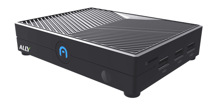 A compact black mini pc with a ridged top, labeled “ALLY” on the front, featuring several USB ports and indicator lights—designed by Azulle for modern workspaces.