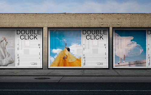 Three large posters on a brick wall display the words "DOUBLE CLICK" above images of people in dynamic poses with colorful backgrounds and event details on the sides.
