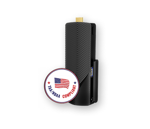 A black rectangular device with a gold connector, featuring a diagonal herringbone pattern, is shown next to a round badge labeled "TA/NDDA Compliant" with a U.S. flag.