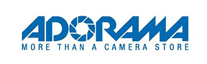 Adorama logo in blue text with the tagline "More Than A Camera Store" below. The letter "O" is stylized as a camera shutter.