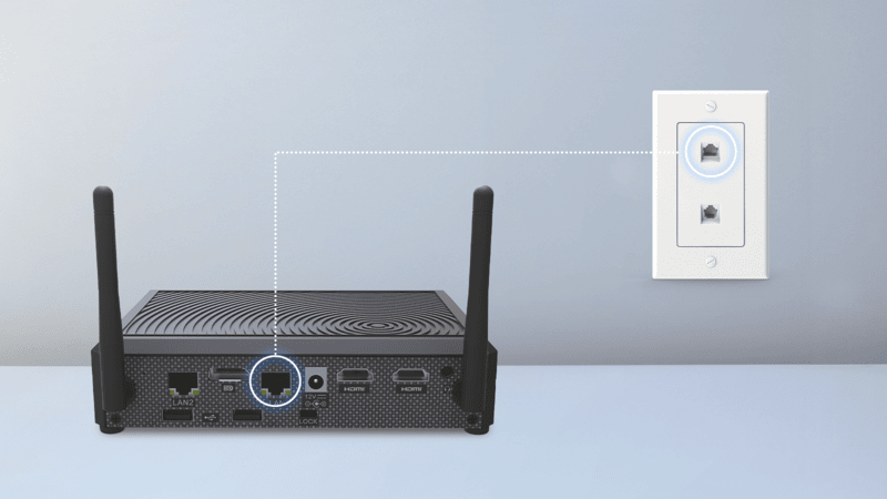 A black wireless router with two antennas is connected to an Ethernet wall socket via a highlighted Ethernet port.