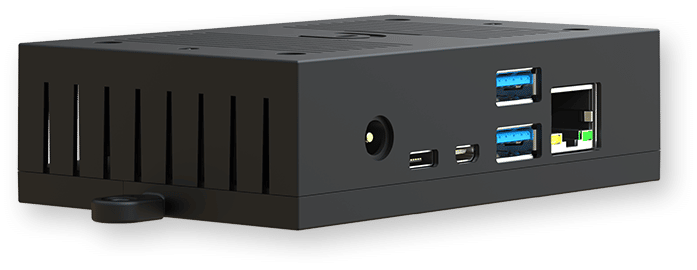 A black rectangular electronic device featuring USB ports, Ethernet port, HDMI ports, a power port, and ventilation slits.